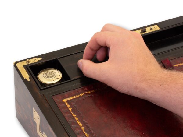 View of how to access the secret compartment in the Antique Coromandel Writing Box Fisher