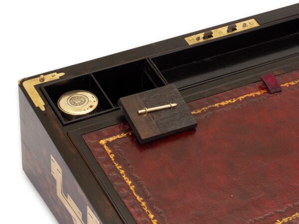 View of how to access the secret compartment in the Antique Coromandel Writing Box Fisher