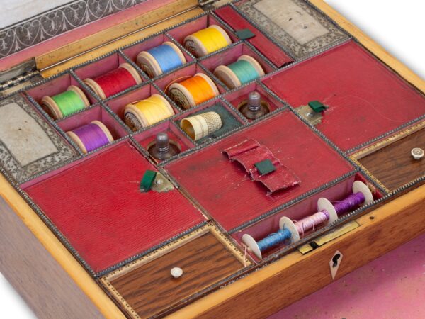 Close up of the sewing box accessories in the Antique Rosewood Sewing Box