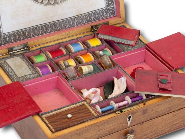 Close up of the sewing box accessories in the Antique Rosewood Sewing Box