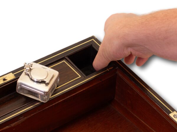 Showing how to access the secret compartment in the Antique Rosewood Writing Box William Chrisp