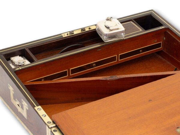 Showing how to access the secret compartment in the Antique Rosewood Writing Box William Chrisp