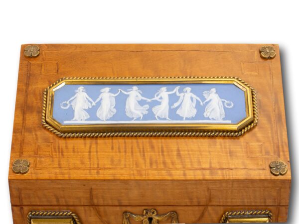 Close up of the Dancing Hours wedgwood on the Satinwood and Biscuit Porcelain Stationery Box