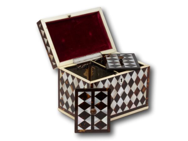 Front overview of the Tortoiseshell and Mother of Pearl Harlequin Tea Caddy with the lid up and caddy lids placed decoratively