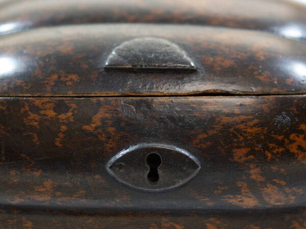 Close up of the thumb plate and escutcheon on the Unique Laying Squash Fruit Tea Caddy with the lid up