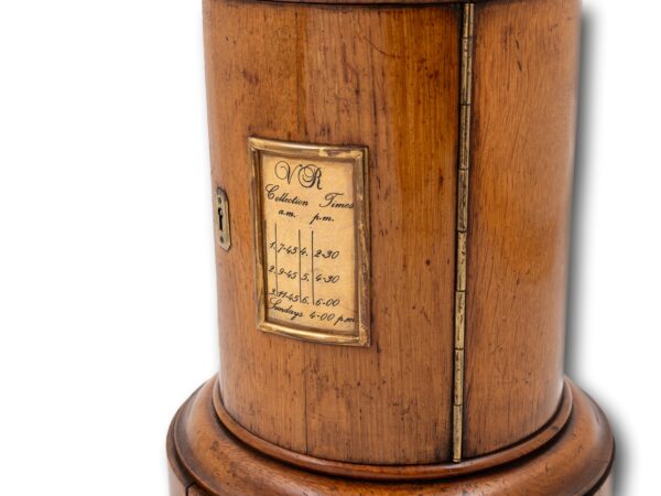 Close up of the collection times on the Country House Oak Letter Box Rodrigues