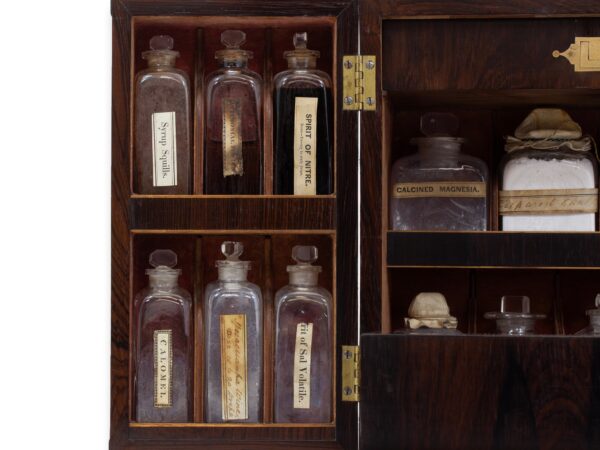 Close up of the Rosewood Apothecary Cabinet glass bottles