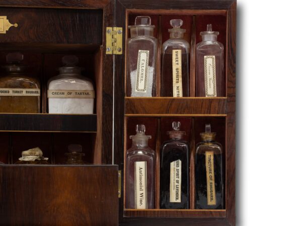 Close up of the Rosewood Apothecary Cabinet glass bottles