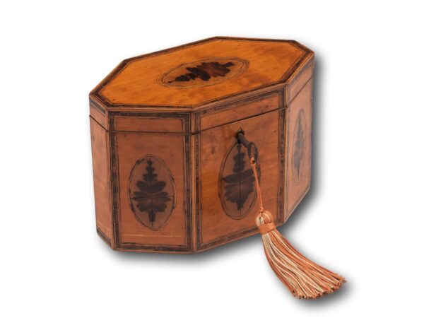 Front overview of the Satinwood Octagonal Tea Caddy with the key fitted