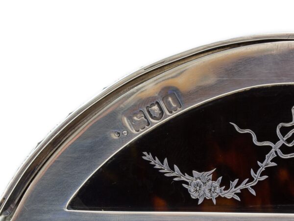 Close up of the sterling silver william comyns hallmarks