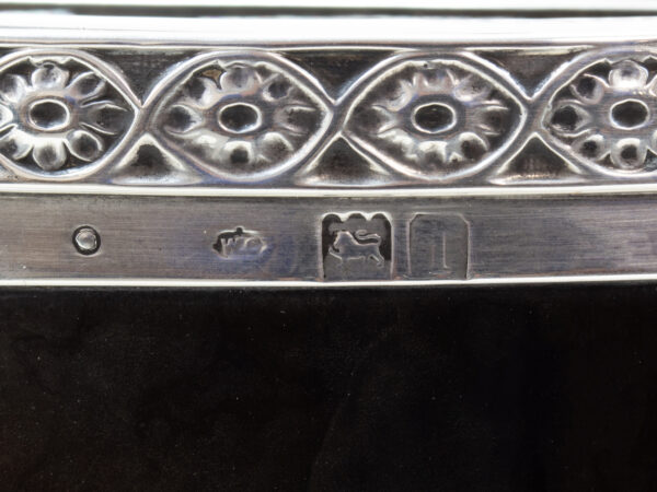 Close up of the sterling silver william comyns hallmarks