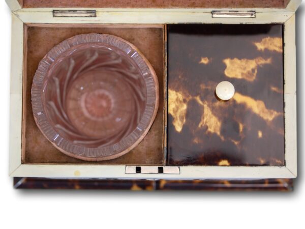 Close up of the tea compartment and glass bowl of the Tortoiseshell and Mother of Pearl Tea Caddy