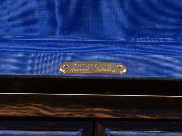 View of the Betjemann makers label in the rear of the Coromandel Tiered Jewellery Box George Betjemann