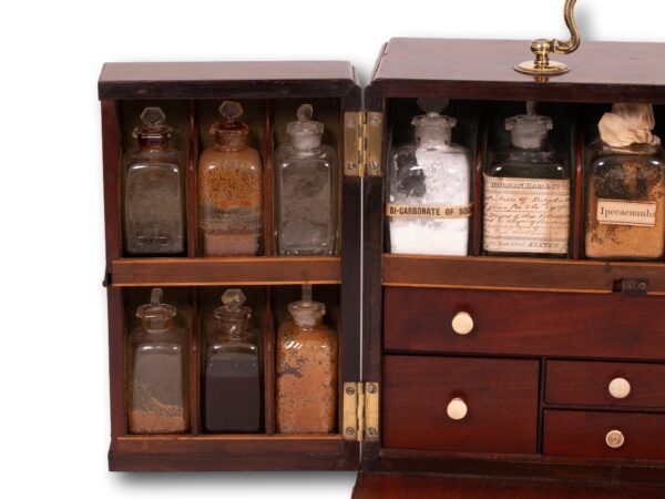 Close up of the left hand side of the Mahogany Apothecary Cabinet with Poison Compartment