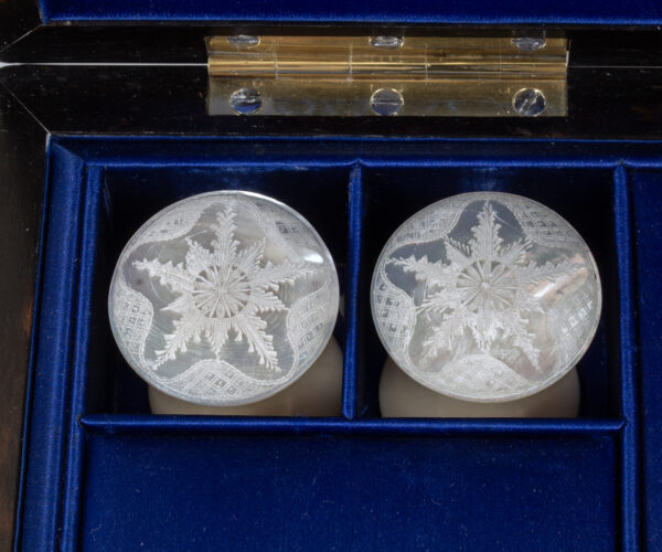 Close up of the Lund mother of pearl engraving in the Coromandel Sewing Box Lund