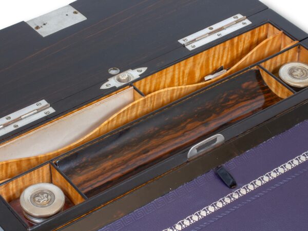 Close up of the pen tray, inkwells and storage inside the Coromandel Silver Mounted Writing Box Betjemann