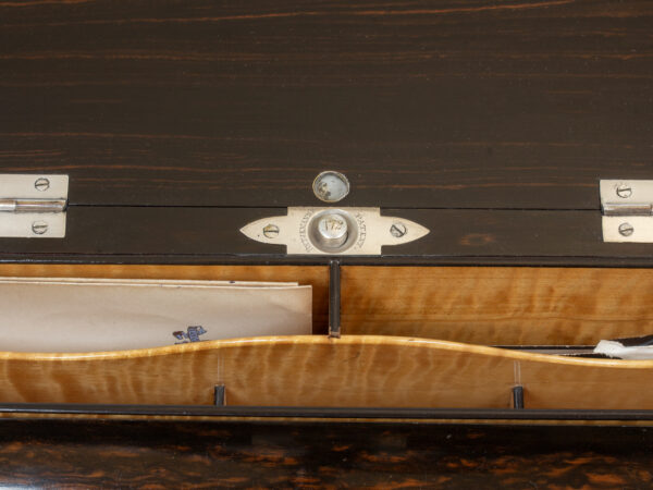 Close up of the compartment push button from the Coromandel Silver Mounted Writing Box Betjemann