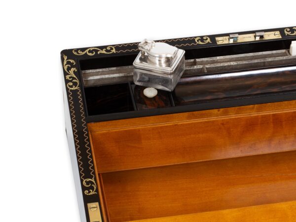Close up of the secret compartment activation in the Coromandel Inlaid Writing Box Hausburg