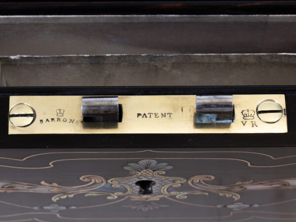 Close up of the Barron lock plate in the Coromandel Inlaid Writing Box Hausburg
