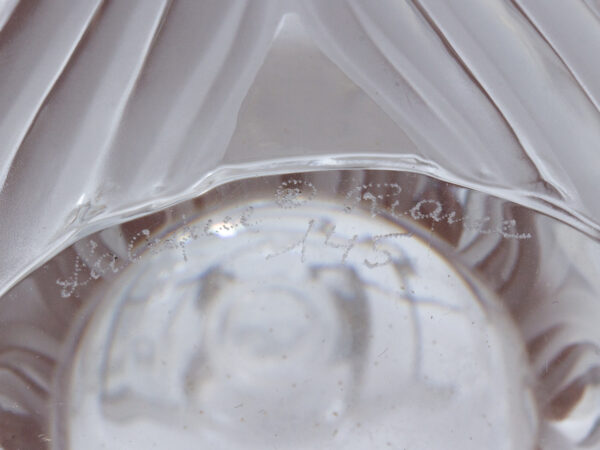 Close up of the signed base of the bottles of the French Lalique Tantalus
