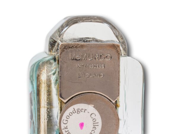 Close up of the makers mark on the base of the Mcmurdo Aquarium Table Lighter