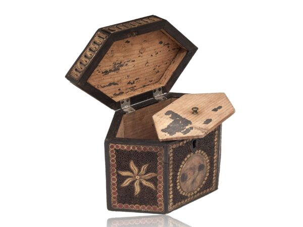 Front of the Paper Scroll Tea Caddy with the lid up and floating lid balanced