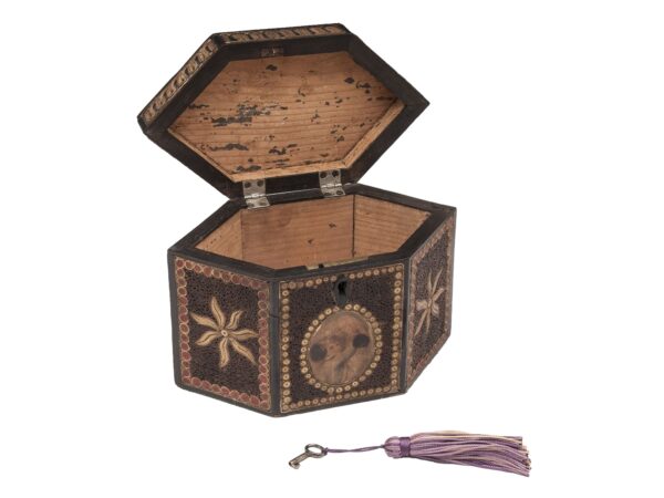 Front of the Paper Scroll Tea Caddy with the lid up and key showing