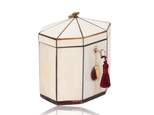 Front overview of the Antique Ivory Tent Top Tea Caddy with the key fitted