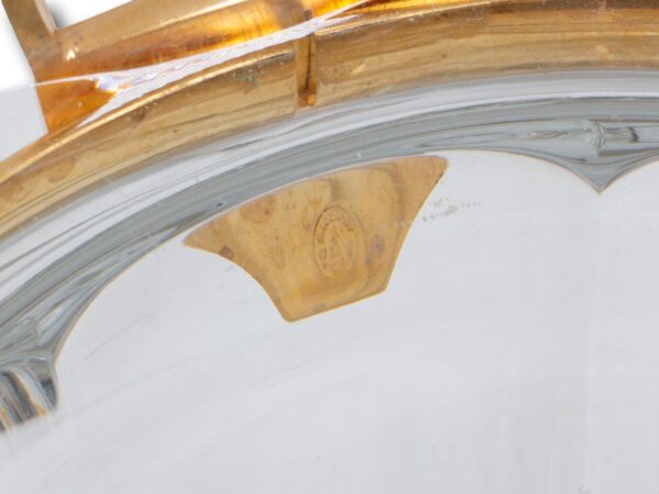 Close up of one of the baccarat logos from the inner handle of the Baccarat Gold Crystal Champagne Cooler