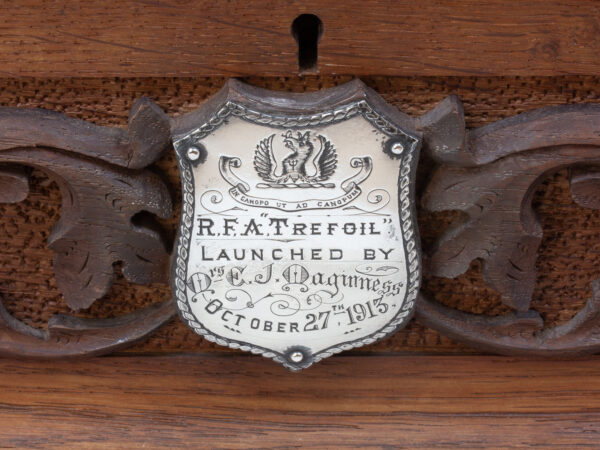 Close up of the engraved plaque on the front of the HMS Trefoil Ship Launching Presentation Casket