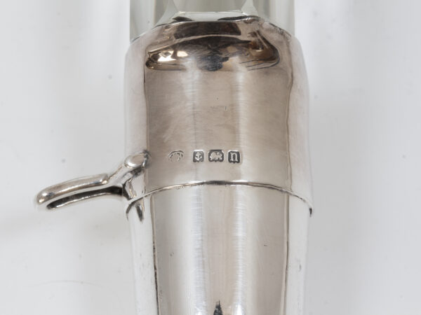 Close up of the sterling silver hallmarks from the Pair of Tilting Decanters Hukin & Heath