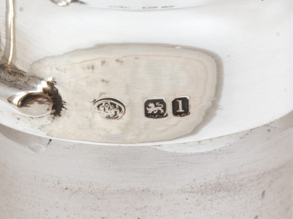 Close up of the sterling silver hallmarks from the Pair of Tilting Decanters Hukin & Heath