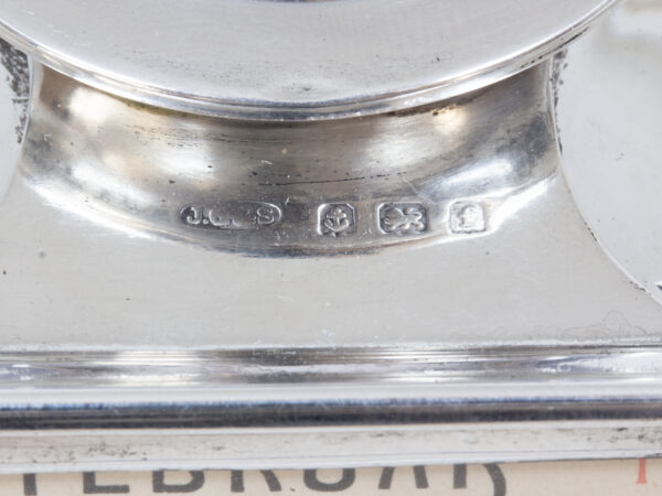 Close up of the John Grinsell and Sons silver hallmarks from the Silver Desk Inkwell Calendar Clock