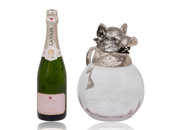 Overview of the Spanish Boars Head Pitcher Valenti next to a standard bottle of champagne