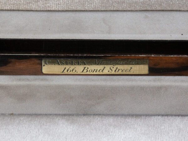 Close up of the Asprey mark from the His and Hers Coromandel Jewellery Boxes by Asprey