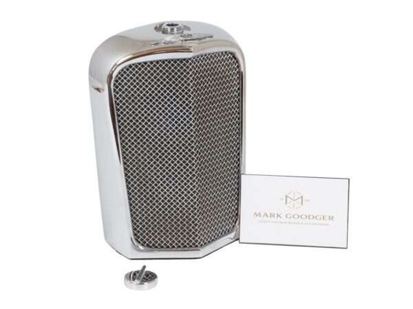 Jaguar SS Car Radiator Decanter by Ruddspeed next to a standard sized business card for scale.