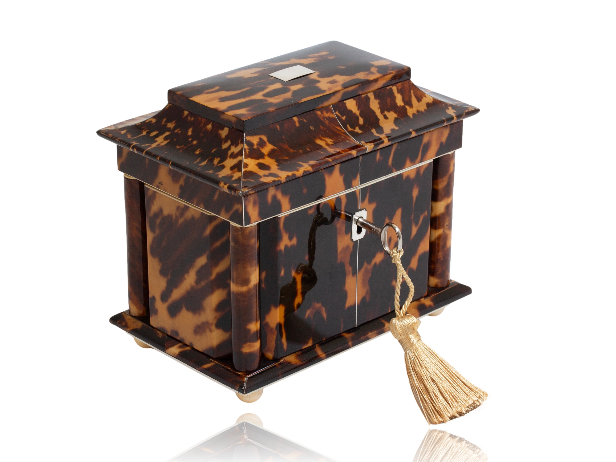 Tortoiseshell tea caddy front angled profile with the key fitted