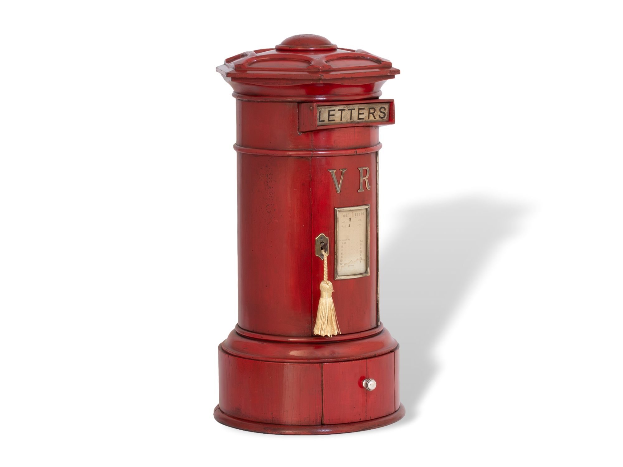 Red post box front angled profile with the key fitted